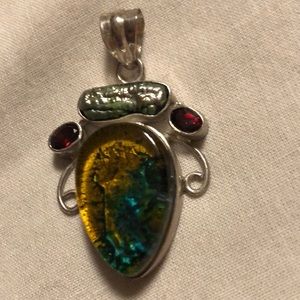 Beautiful pendant blue and gold, with 2 garnets set in real silver, top stone